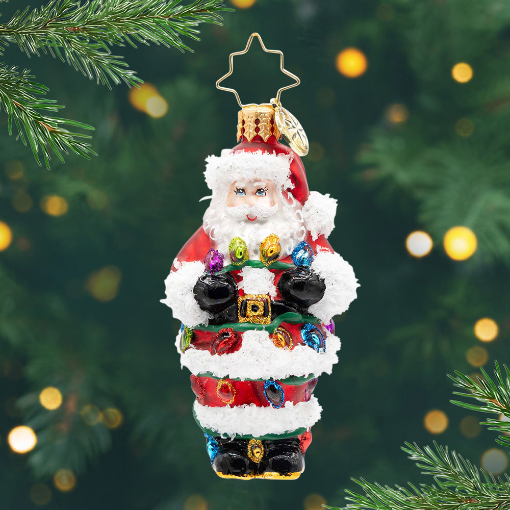 Tangled Up Santa Gem. Ornament of Santa in his red suit, wrapped in colorful Christmas lights. View of front