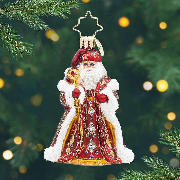Years In The Making Nick Gem. Santa ornament of him in a dark red and gold sparkly detailed robe while holding a gold staff. View of front.