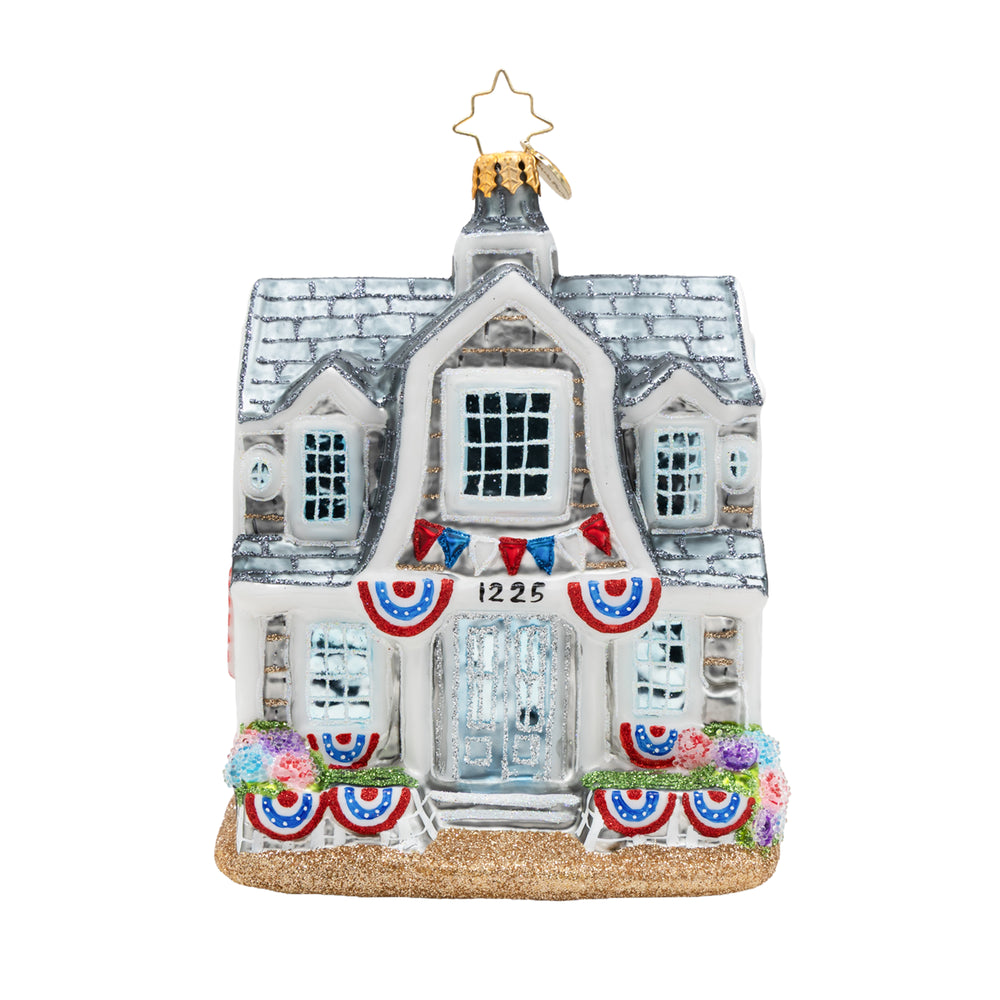 Decorative house ornament with flags and flowers on a white background