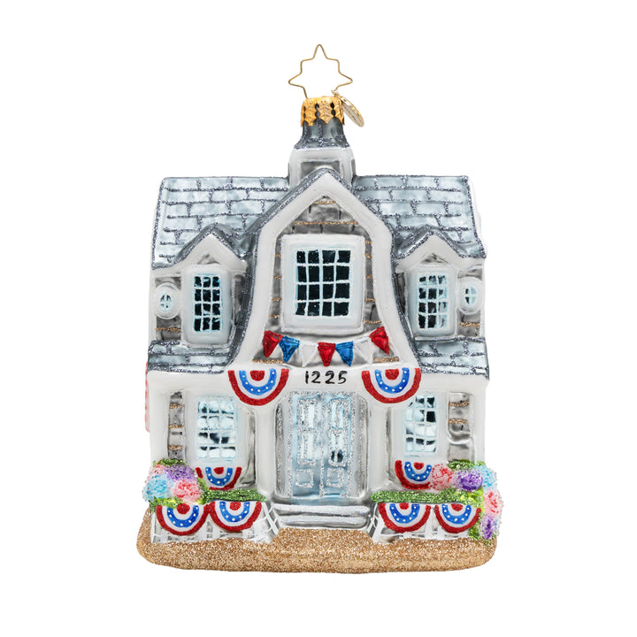 Decorative house ornament with flags and flowers on a white background