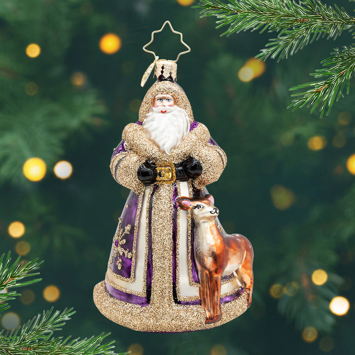 Woodland Wonder Santa. Ornament of Santa in a purple and gold globe with a dear next to him. View of front