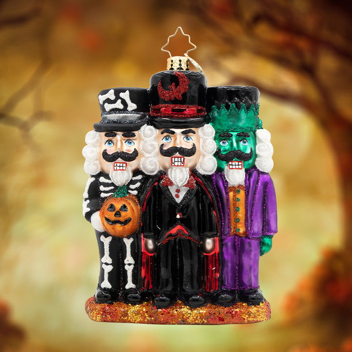 Spook-tacular Trio. Ornament with three nutcrackers dressed as a skeleton, vampire, and Frankenstein. View of front
