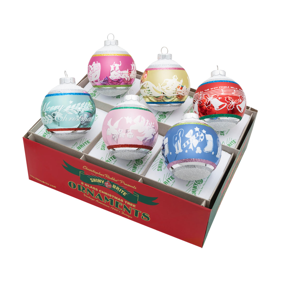 CHRISTMAS CONFETTI 6 COUNT 3.25" SIGNATURE FLOCKED ROUNDS. Six silvers round ornaments with big and small stripes in colors of red, blue, teal, pink, and yellow, and each with its own design in white.