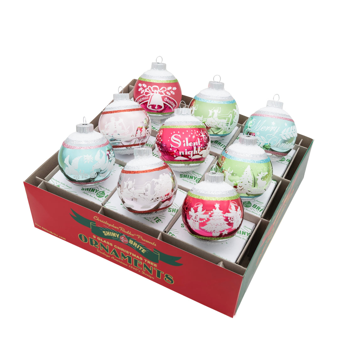 FESTIVE FETE 9 COUNT 2.5" SIGNATURE FLOCKED ROUNDS. Nine round ornaments with a big stripe ranging from colors of red, pink, green, and teal, and each with its own design.