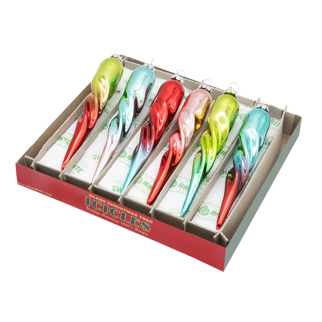 FESTIVE FETE 6 COUNT 5" GLASS ICICLES. Six icicle shaped ornaments in ombre colors of red, green, teal, and pink.