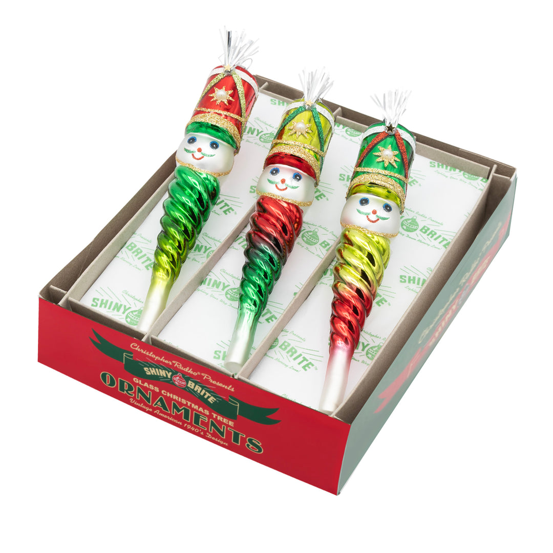 HOLIDAY SPLENDOR 3 COUNT 7" NUTCRACKER ICICLES. Three icicle ornaments with ombre colors of red and green, each with a nutcracker on the top.