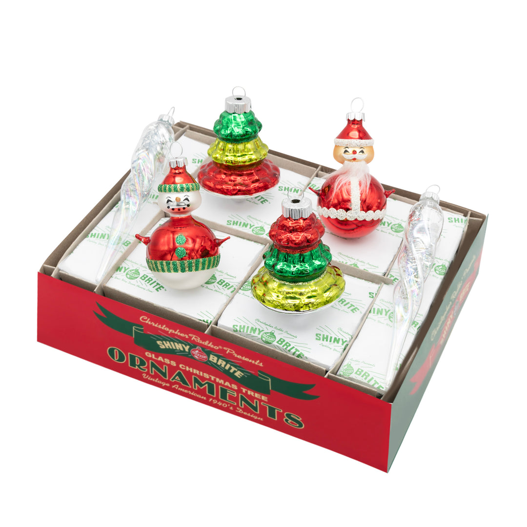 HOLIDAY SPLENDOR 6 COUNT MIXED SHAPES AND FIGURES. Two round ornaments, one with Santa and the other with a snowman, and two tree shaped ornaments, with all four being in colors of red, dark green, and light green. Also, two clear icicle shaped ornaments with silver tinsel inside