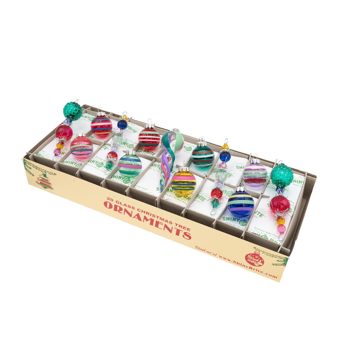 VIVID VINTAGE 13 COUNT 4” ICICLES & 1.25” ROUNDS. Eight round transparent blue, green, red. pink, yellow, and purple ornaments with multicolored stripes, four icicles each with five to size transparent colored ornaments and one VIVID VINTAGE, also transparent with stripes. 