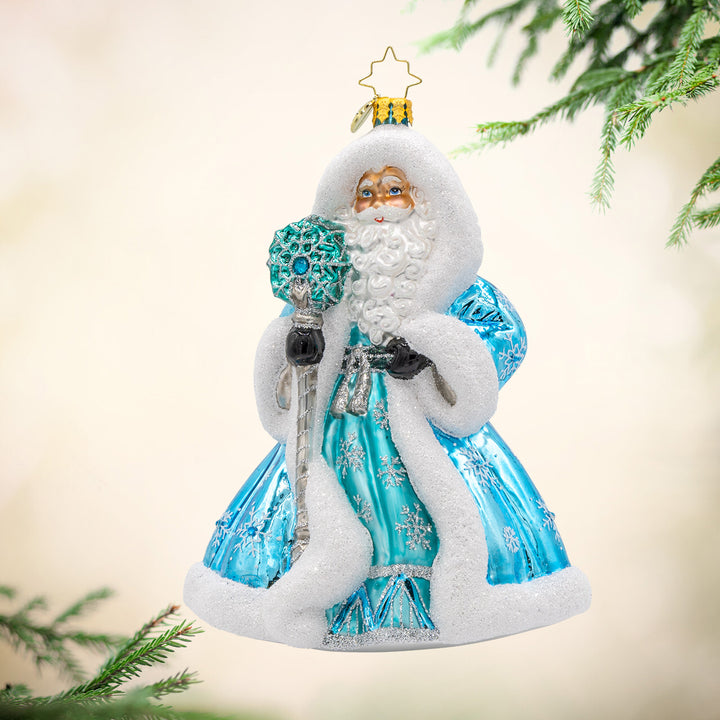 This Santa Claus ornament dons a blue robe, meticulously crafted and adorned with exquisite details. Viewed from front.