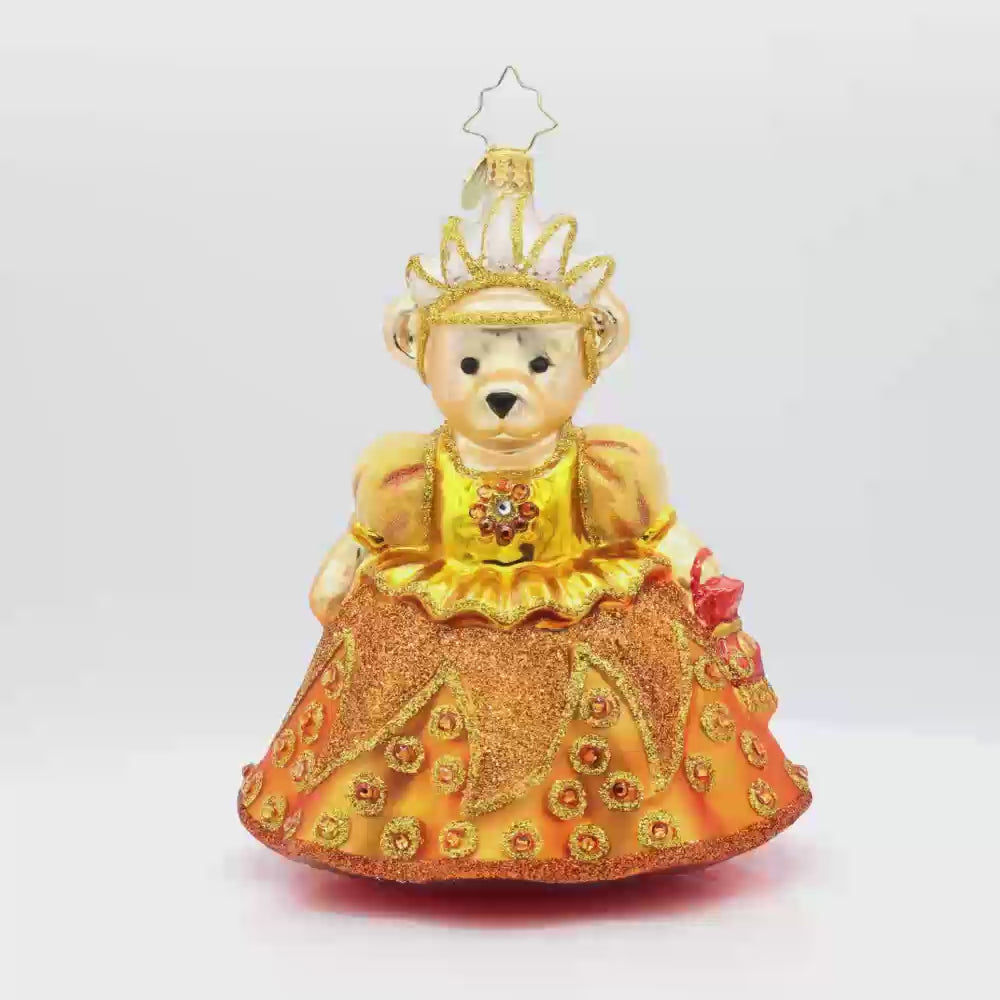 A Muffy Millennium ornament. This bear wears a gold satin gown adorned with jewels and a crown. Video.