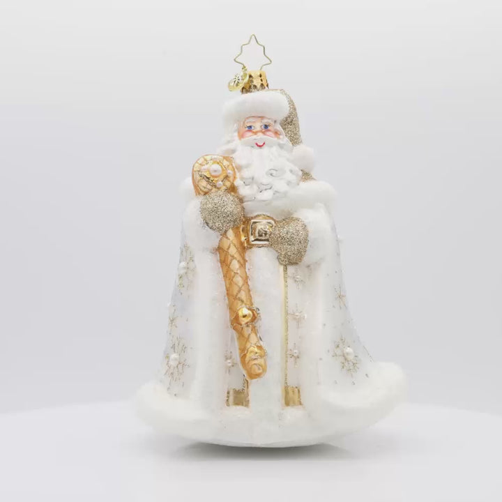 Gilded Kris Kringle ornament. Dressed in a shimmering robe, adorned with sparkling jewels and a regal crown. His festive cape and shimmering staff complete this elegant ensemble. Video.