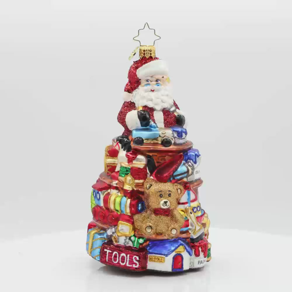 NorthPole Workshop Ornament. Santa atop a pile of toys. Video.