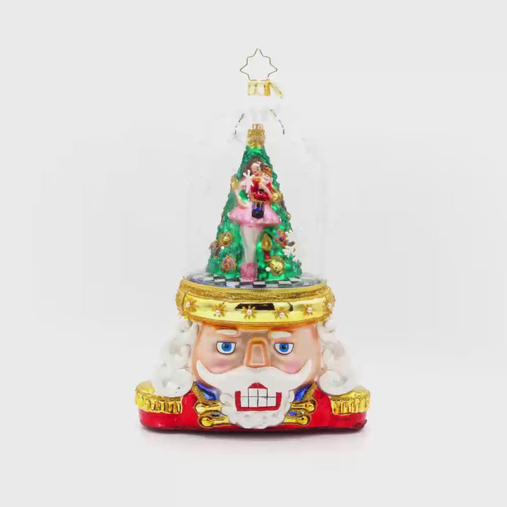 Enchanted Guard ornament. A ballerina dances around a Christmas tree inside a snow globe that makes up the guard's hat. Video.