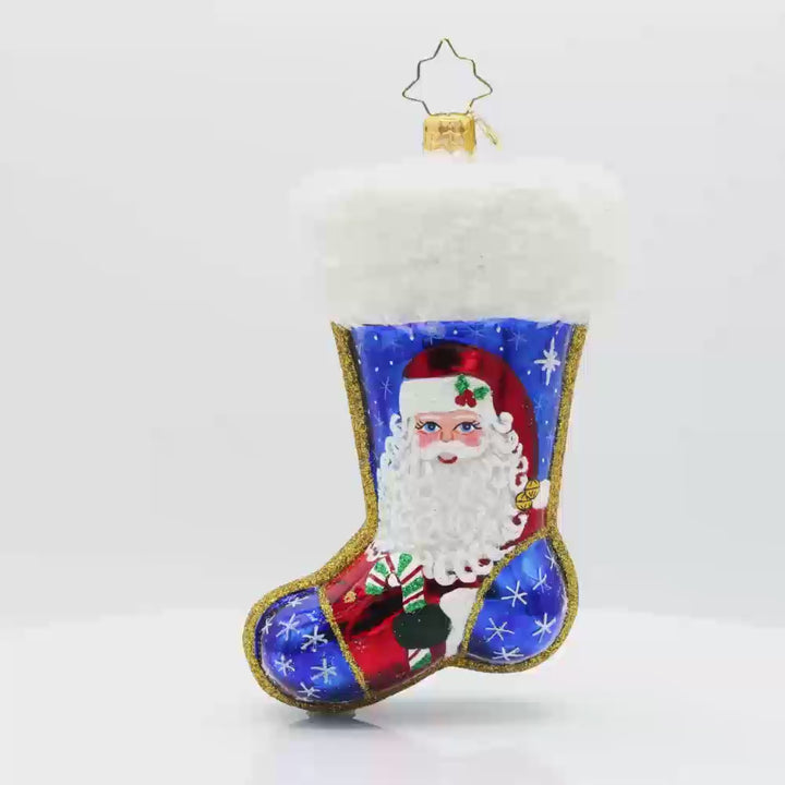 Winter Wishes Stocking ornament. This stocking is adorned with shimmering snowflakes, a jolly snowman, and a festive cardinal. Video.