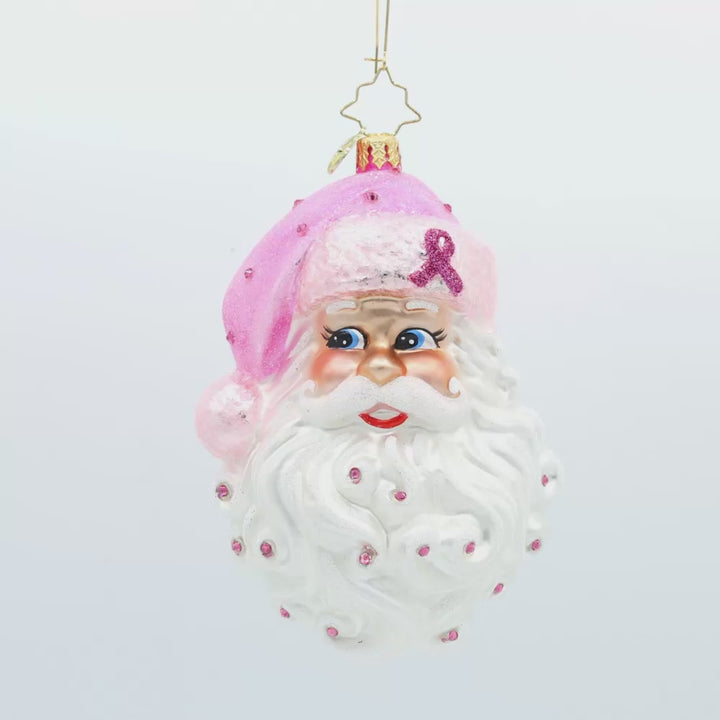 Strength in Pink ornament. This Santa head features a pink breast cancer awareness ribbon on his pink hat. Video.