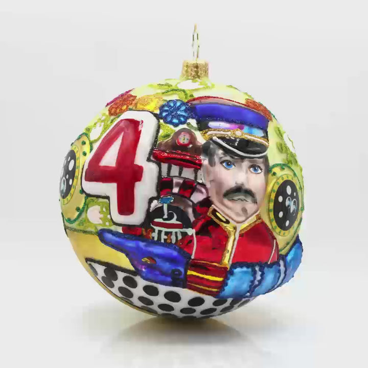 Beatle's Christmas Command Ornament. Decorated round with Beatle's yellow submarine imagery. Video.