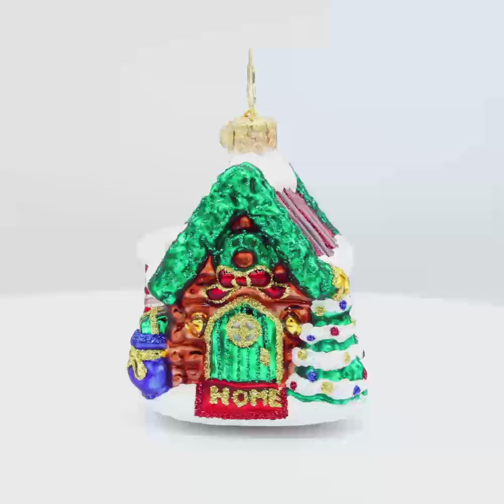 Hidden Woods Hideaway Gem ornament. A log cabin covered in snow and festive cheer. Video.