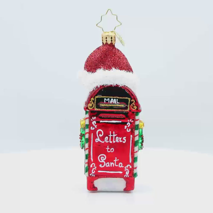 North Pole Postbox ornament. A festively decorated red postbox with "Letters to Santa" written on it. Topped with Santa's red hat. Video.