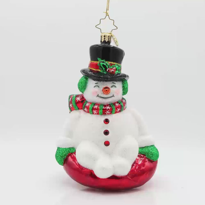 Snowy Slider ornament. This snowman is bundled up with a top hat sitting on a red innertube. Video.
