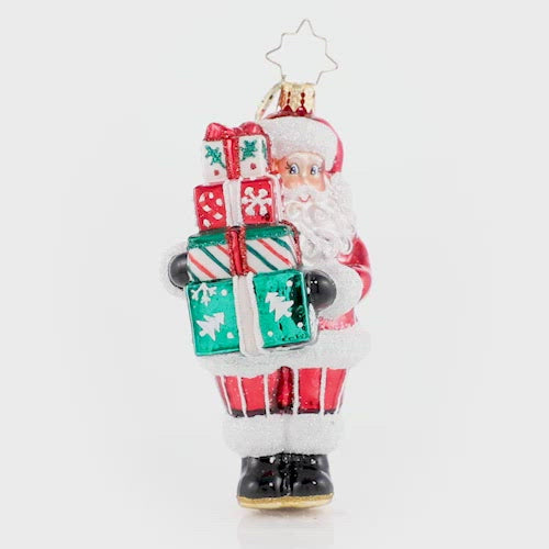 Video - Ornament Description - Time To Celebrate!: Santa is in the spirit! He just could not wait to deliver these festive gifts. Do not worry, he will be back again on Christmas Eve! This video shows the ornament spinning slowly. 