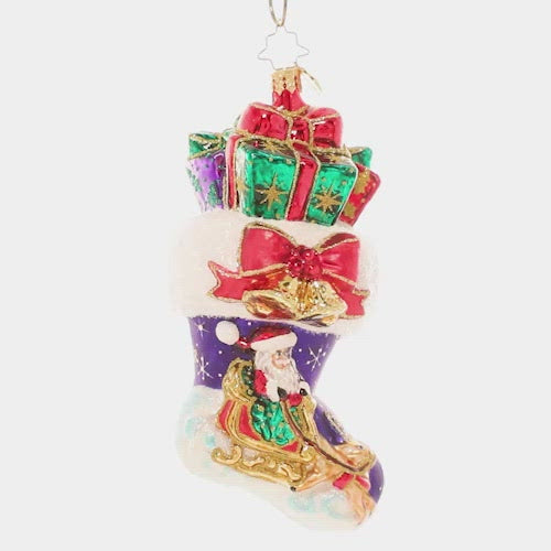 Video - Ornament Description - Night Before Christmas Stocking: And what a night it was! This classic overstuffed stocking ornament showcases a snowy Christmas Eve vignette. This video shows the ornament spinning slowly. 