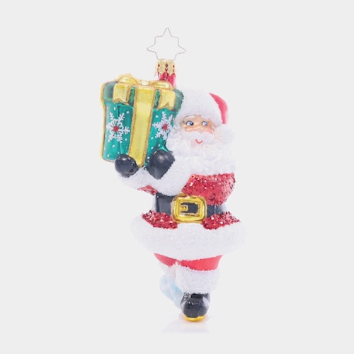 Video - Ornament Description - TipToe To The Tree: Santa must be sneaky in order to get this gigantic gift under the tree without waking anyone up! This merry ornament is an adorable addition to your collection. This video shows the ornament spinning slowly. 