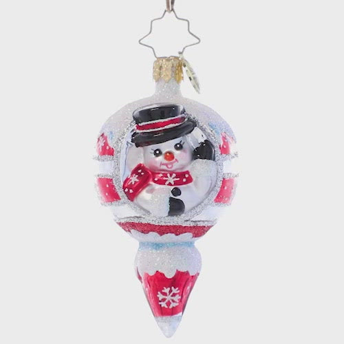 Video - Ornament Description - A Frosty Hello Gem: A smiling snowman waves from within this cheery icicle ornament. Painted in holiday red and crowned with a dusting of sparkling snow, this vintage-inspired piece is the perfect way to add classic Christmas cheer to your tree.