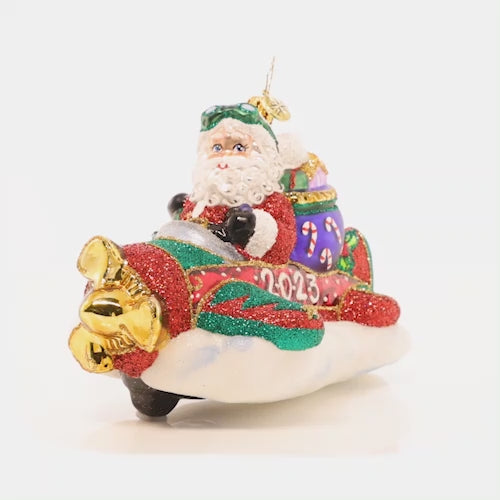 Video - Ornament Description - This Year is Flying By: Santa is taking to the skies in a different type of ride for the New Year…he's switching out his signature sleigh for a one-man plane! This video shows the ornament spinning slowly. 