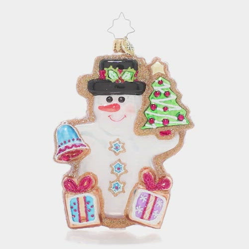 Video - Ornament Description - Gingerbread Snowman: Fresh from the oven, this darling gingerbread snowman smiles in royal icing. He aims to make the season a little sweeter with Christmas cookie gifts, bells, and trees for all!