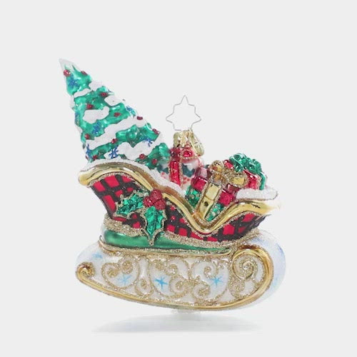 Video - Ornament Description - Snowy Sleigh Ride: This delightful sleigh is packed to the gills with everything you need for a joyful Christmas, even the tree.  This video shows the ornament spinning slowly.