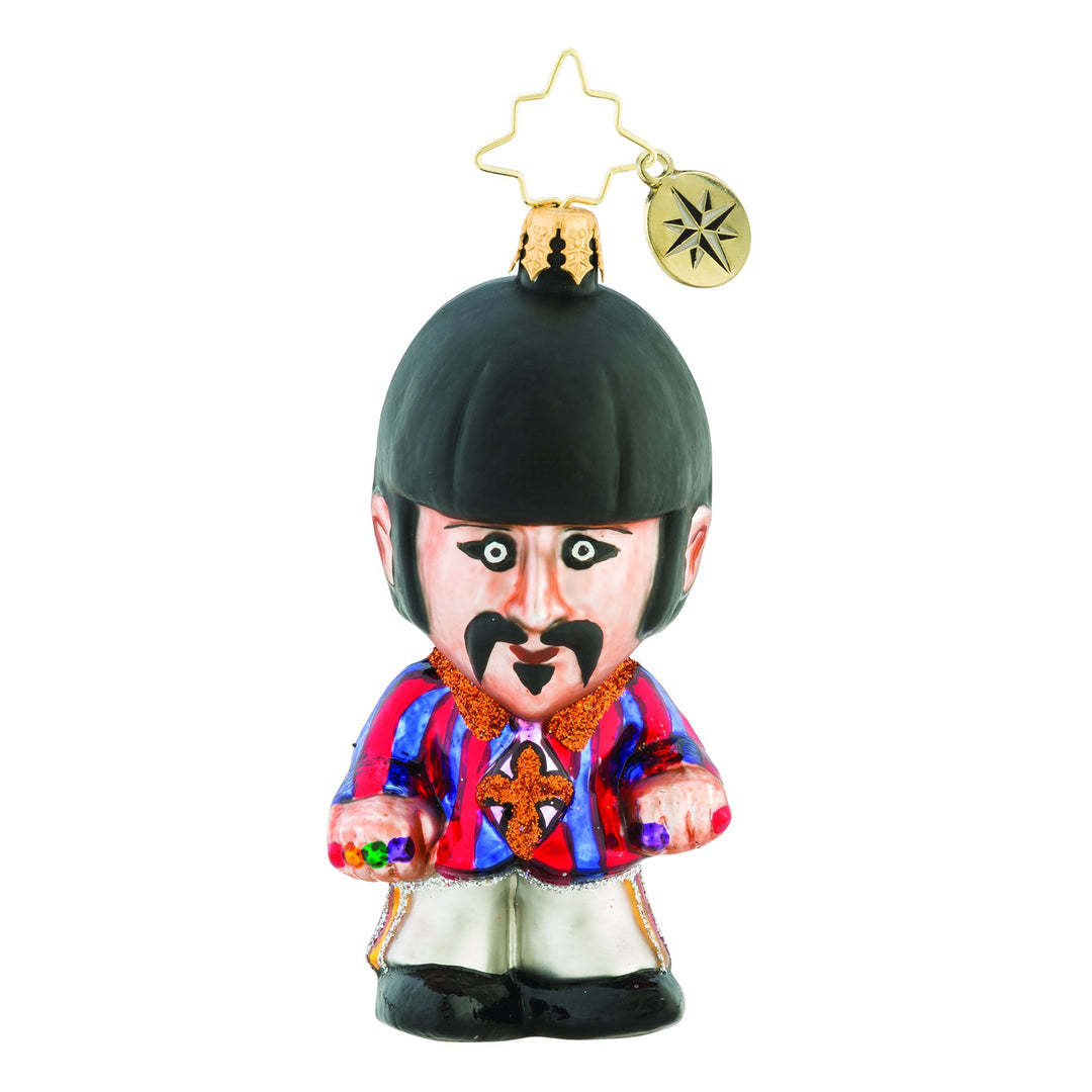 Ornament Description - Still a Star: Slightly quirky yet always fun, Ringo was the lighthearted one. Dramatic, flamboyant, and full of flair, on the ground or in the air--what a Starr!