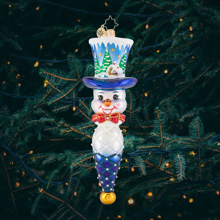 Ornament Description - Jolly Top Hat Snowman: Joy for all to hear! This dapper snowman is wearing a custom top hat, featuring a quaint little cottage in a forest of freshly fallen snow. Watch as an inquisitive young doe checks out this peaceful scene.