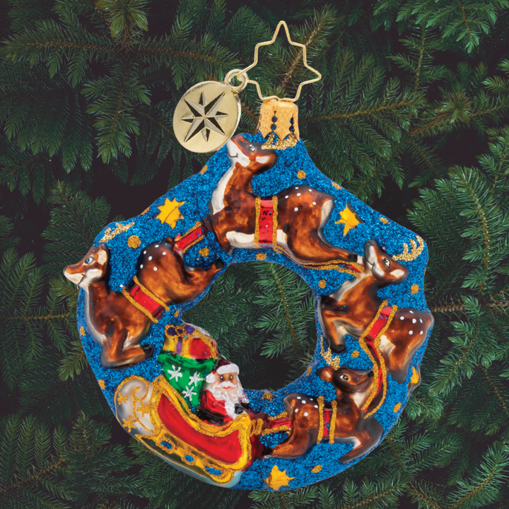 Ornament Description - Santa's Midnight Ride Gem: Flying through the midnight sky, Santa and his reindeer partners are ready to deliver gifts this Christmas Eve!