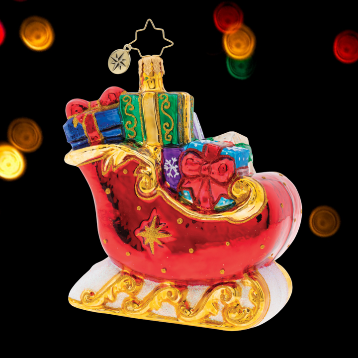 Ornament Description - Sleigh Full of Delights!: What a Brilliant Treasure! This bright red Christmas sleigh is adorned with golden accents and topped with lovely gifts wrapped with care.