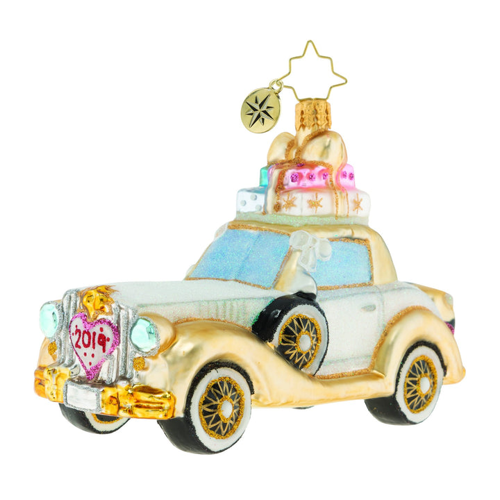 Ornaments - Description: 2019 Wedding Bliss Chariot - The happy couple takes off after their wedding in this wedding bliss chariot! Their gifts stacked high atop the roof and their bags packed for a honeymoon of memories at the back, this loving couple is ready for their happily ever after!