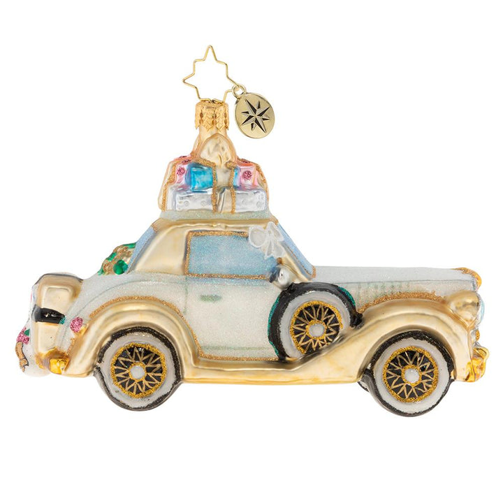 Side - Ornament Description: 2019 Wedding Bliss Chariot - The happy couple takes off after their wedding in this wedding bliss chariot! Their gifts stacked high atop the roof and their bags packed for a honeymoon of memories at the back, this loving couple is ready for their happily ever after!