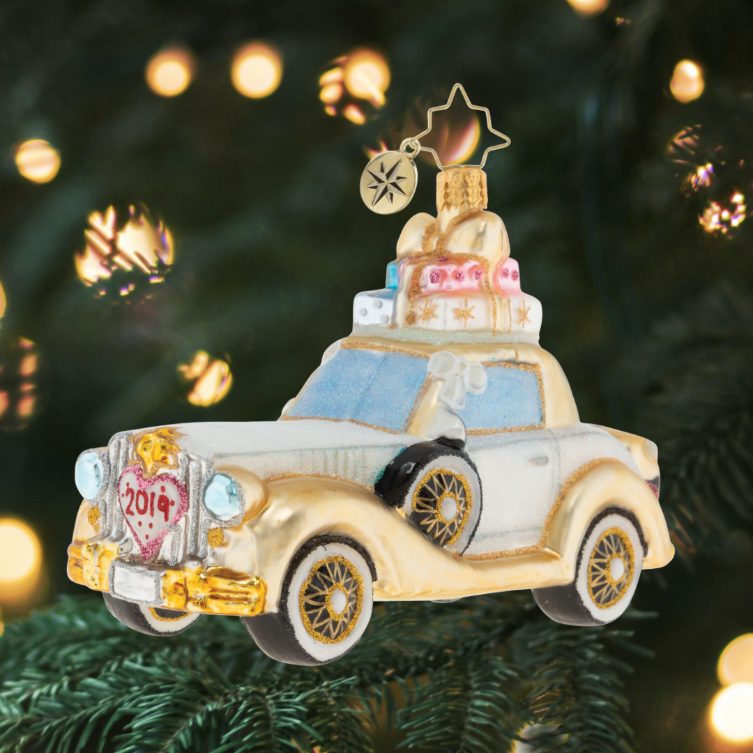 The happy couple takes off after their wedding in this wedding bliss chariot! Their gifts stacked high atop the roof and their bags packed for a honeymoon of memories at the back, this loving couple is ready for their happily ever after!