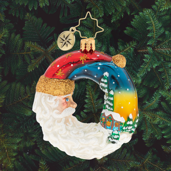 Ornament Description - Santa's Silent Night Wreath Gem: A night both silent and stunning. Santa basks in a brilliant sunset as the sun gives way to the moon.