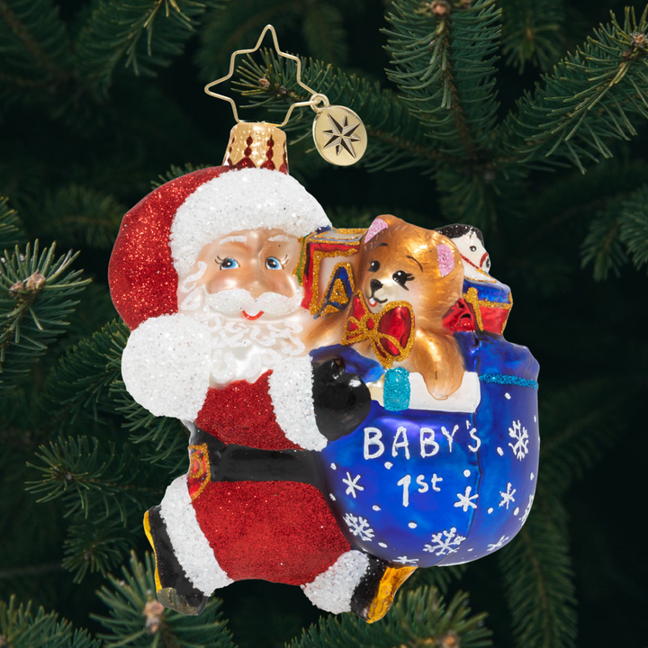Ornament Descripion - Hurry Santa Gem: Santa is hustling just as fast as he can! He's ready to celebrate baby's first Christmas and he simply won't waste a single minute.