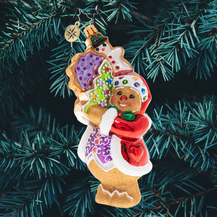 Ornament Description - The Gingerbread Man Can!: In anticipation for the busy season, this gingerbread man has been hitting the gym to get buff. Now even the heftiest deliveries don't feel so tough!