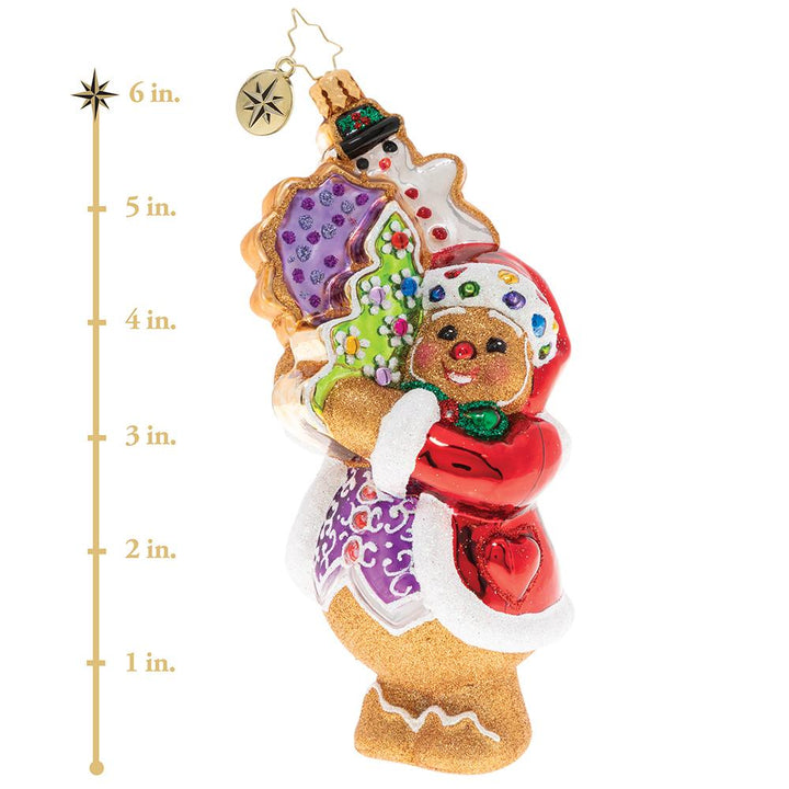 Ornament Description - The Gingerbread Man Can!: In anticipation for the busy season, this gingerbread man has been hitting the gym to get buff. Now even the heftiest deliveries don't feel so tough! This photo shows the ornament is about 6 inches tall,. 