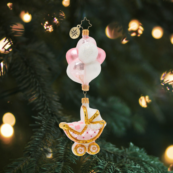 Ornament Description - Baby Girl Buggy & Balloons: What's beautiful, sweet, and as precious as a pearl? It's a gift like no otherâ€”it's a lovely newborn baby girl.