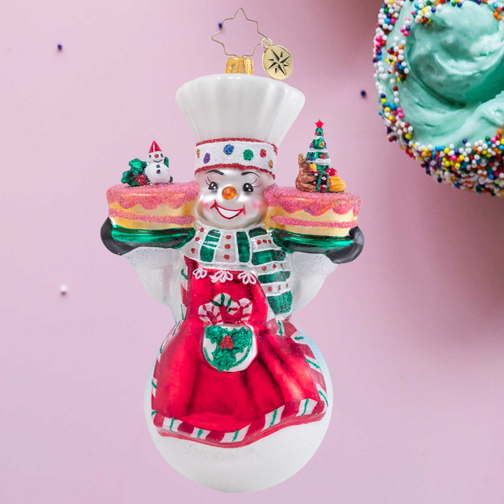 Ornament Description - This Christmas Takes The Cake!: Mr. Snowman has been hard at work in his magical bakery, whipping up all types of sweets as the holidays draw near. These Christmas cakes are sure to fly off the shelves--no one can resist his frosty treats!