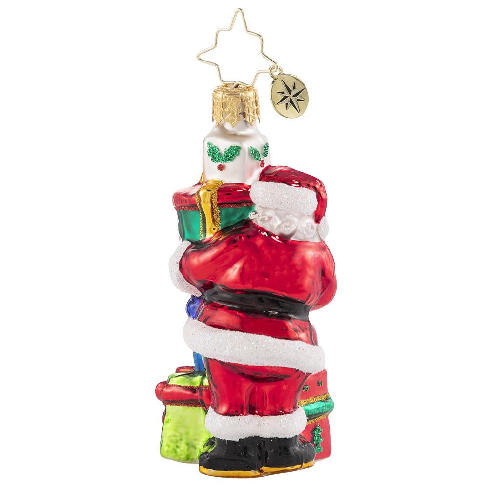 Back - Ornament Description - A Tower of Tidings Gem: Santa sure has his hands full with all these gifts! Luckily after centuries of juggling Christmas responsibilities, he has become an expert at balance!