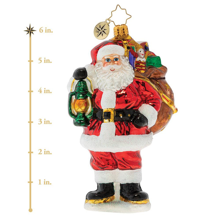 Ornament Description - Our Gallant Guide: The city may be sleeping, but Santa's glowing lantern lights the way as he carries his magic sack of gifts through the darkness of Christmas Eve night. This photo shows the ornament is about 6 inches tall.