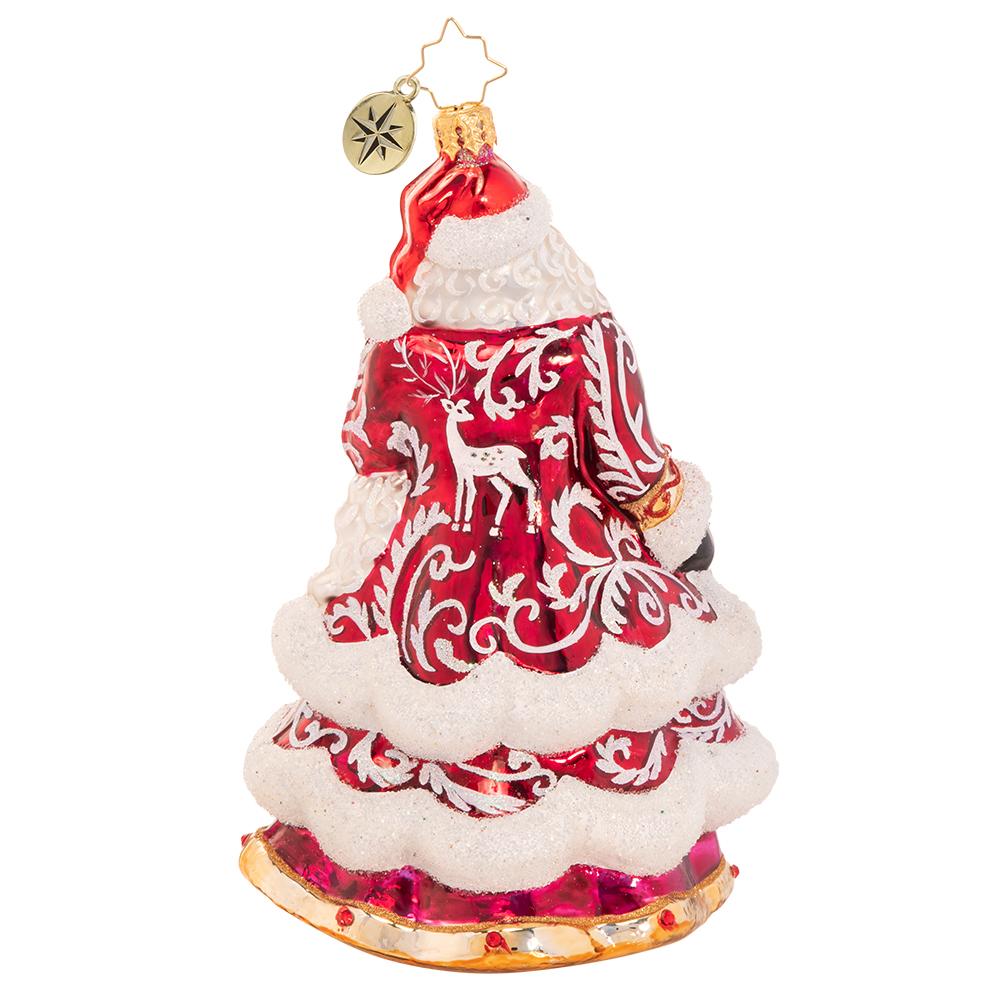Back - Ornament Description - An En-deering St. Nick: Dressed to the nine(point)s in his favorite reindeer-motif robe, Santa reminisces about Christmases past and honors the trusty animal companions that have made his big night possible for centuries.