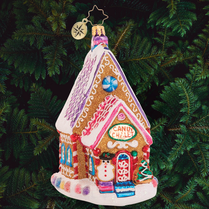 Ornament Description - The Confectioner's Chalet: Nestled right on Candy Cane Lane, this gingerbread house is confection perfection! Rumor has it, it is home to the town candymaker--no wonder it is so sweet!