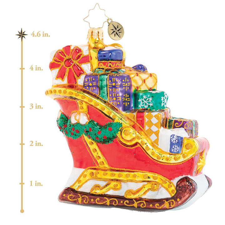 Ornament Description - Joyful Journey Sleigh: The reindeer sure do have their work cut out for them; this sleigh is seriously packed! Overflowing with gifts, it is going to be one seriously hefty haul, but they will do whatever it takes to get Christmas delivered on time! This photo shows the ornament is about 4.6 inches tall. 