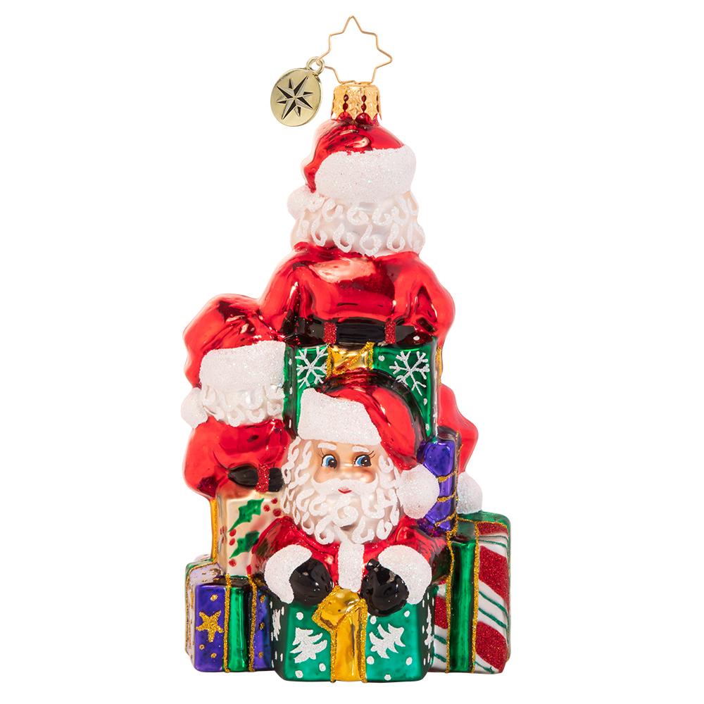Back - Ornament Description - A Tremendous Trio of Santas: Good things come in threes! It is not easy to get all the way around the world in a single night, so Santa used a little Christmas magic to clone himself a few extra pairs of hands this year.