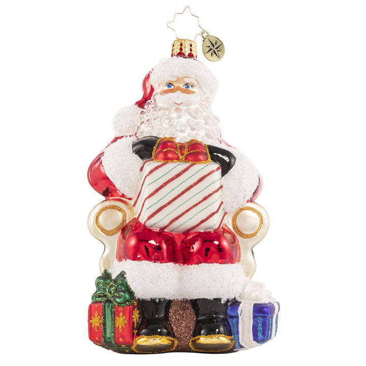Front - Ornament Description - Santa's Lap of Luxury: Santa relaxes on his signature velvet chair, ready to hear the wishes of countless good little boys and girls. Naughty or nice, Santa always delivers!